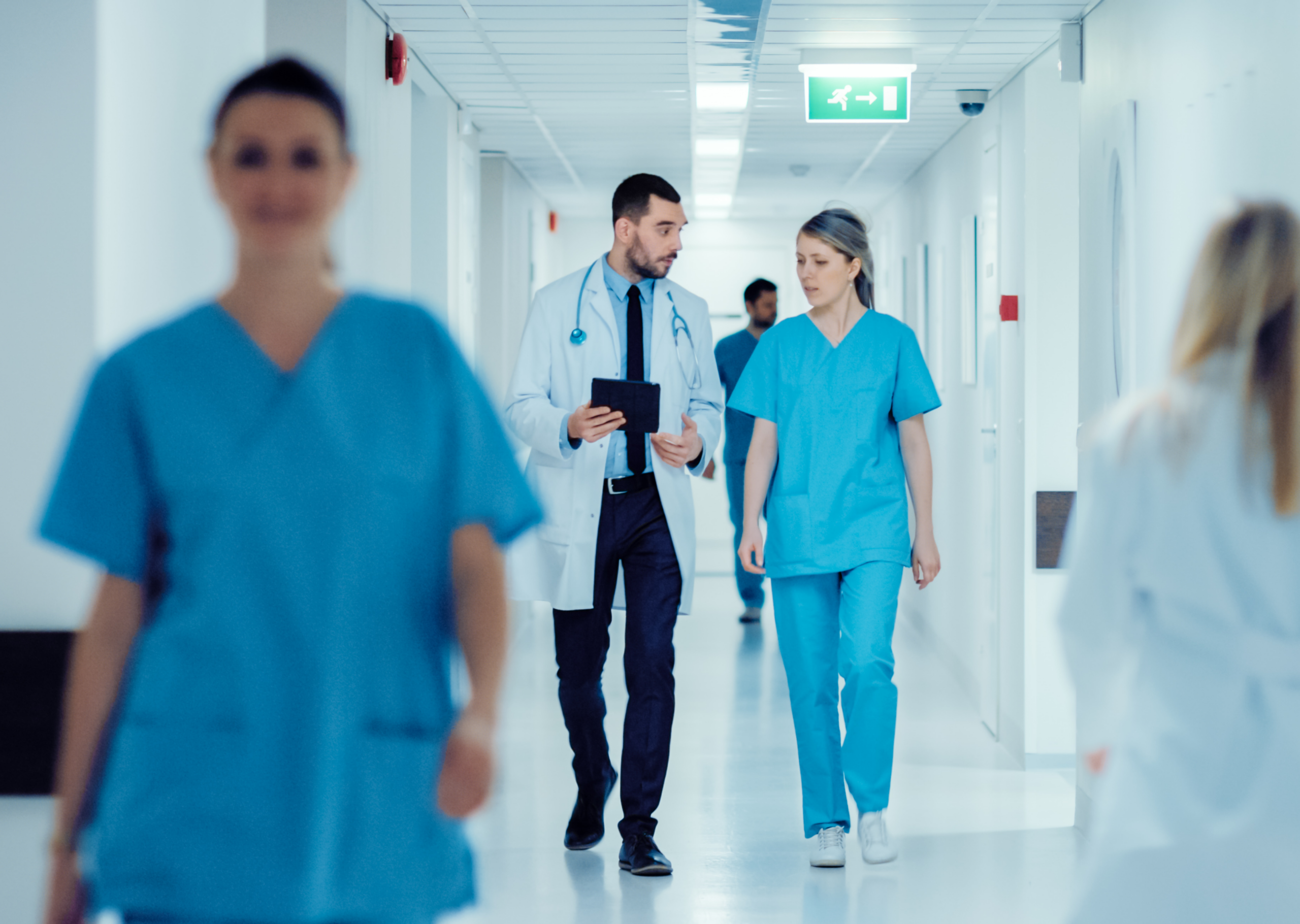Doctors walking through a hospital hallway.